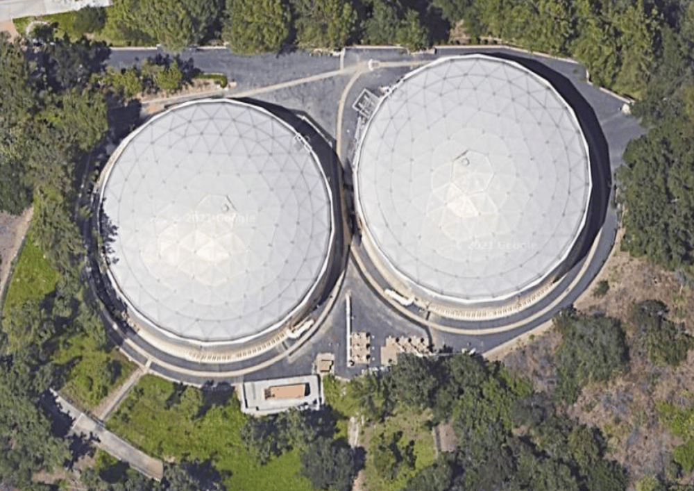 Aerial shot of two large municipal water tanks